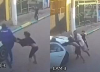 Câmera de segurança registra criminoso tentando arrastar criança para dentro de táxi, mas homem age rápido e salva o garoto. VEJA VÍDEO